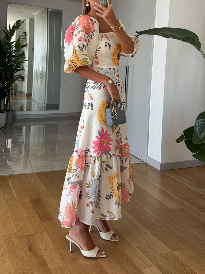 CAMILLE – BLOEIENDE ELEGANTIE JURK MET PUFFMOUWEN